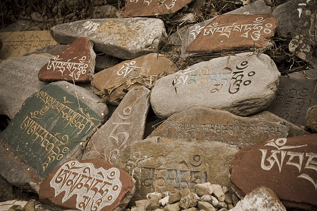 Stonen tablets with prayers in Tibetan at a Temple in McLeod Ganj