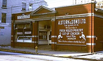 The second and current St. Patrick's Market building built in 1912. This picture was taken in 1971 when the building was occupied by A. Stork & Sons. Stpatrickmarket1960s.jpg
