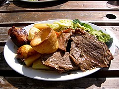 Sunday roast: roast beef (by 18th century),[64] roast potatoes, vegetables and Yorkshire pudding (1747)[65]
