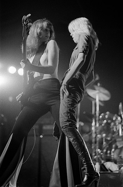 Fuchs (left) on stage with Cherie Currie, 1976