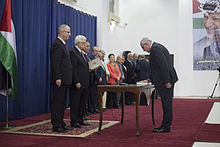 Riyad Al-Maliki the foreign minister swear in front of the Palestinian president Mahmoud Abbas, at Al-Muqata'a H.Q. in Ramallah. The new Palestinian unity government sworn in Ramallah.jpg