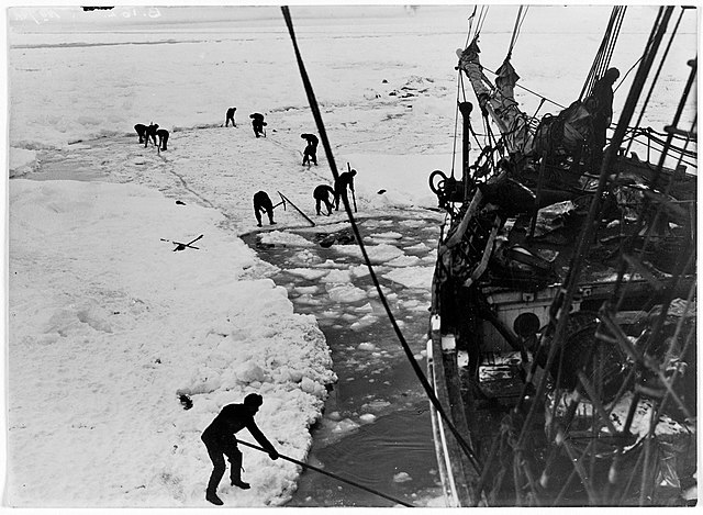 Crew members working to free the ship from the ice