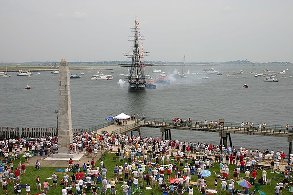 USS Constitution renders a 21-gun salute to Fort Independence during her Independence Day turnaround cruise
