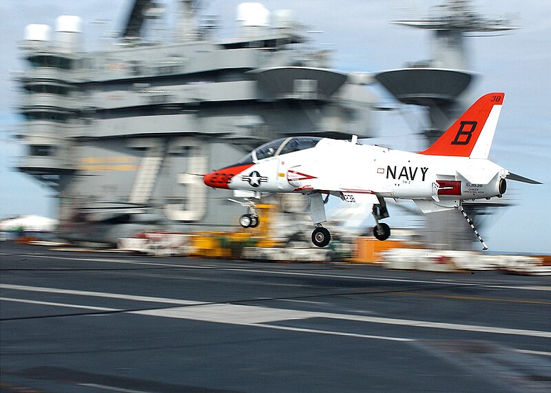 File:US Navy 030131-N-8213G-001 A T-45A Goshawk makes a final approach with tail hook down during an arrested landing.jpg