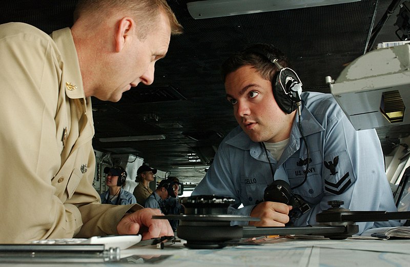 File:US Navy 060606-N-7526R-018 Quartermaster 2nd Class Adam Congello receives training on navigation charts from Senior Chief Quartermaster Jace Loucks as the Nimitz-class aircraft carrier USS Ronald Reagan (CVN 76).jpg
