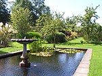 a rectangular pond within a walled garden