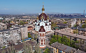 Old city watertower and Orthodox Church of the Intercession of the Mother of God in Mariupol - aerial view.