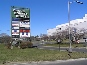 The iconic former marquee of the Cross County Shopping Center with Macy's in the background