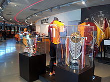 Podolski's Galatasaray shirt, on display with the Süper Lig and Turkish Cup