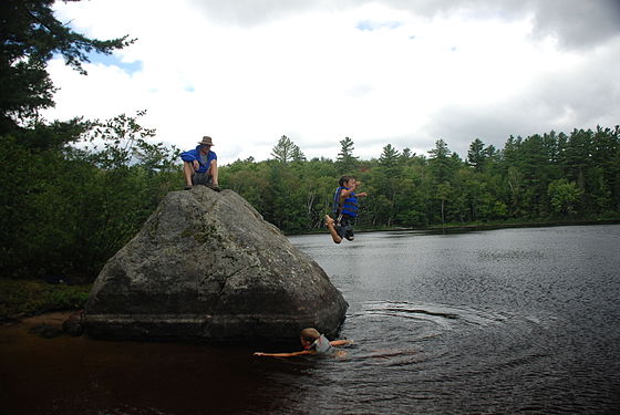 Kids jumping into a lake in Adirondacks, NY