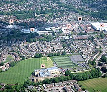 Central Yate from an aircraft (2017), including the Sports Centre, shopping centre, Yate Academy and the Parish Church Aerial of Yate, South Gloucestershire, England 24May17 arp.jpg