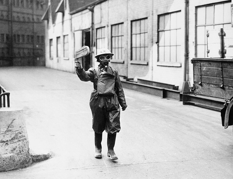 File:An air-raid warden sounds a gas alert with his rattle during an exercise, 14 March 1940. HU88535.jpg