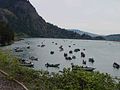 Anglers crowd people in boats on water.jpg