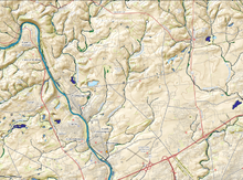 A USGS aerial view of the 6.6-7 miles (10.6-11.3 km) Catasauqua Creek Valley chosen to provide water power for the newly imported blast furnace technologies and other raw materials resources, including iron ore, firebrick clay, and limestone Area View around Catasauqua Creek and the Crane Iron Works in 2017-USGS.png