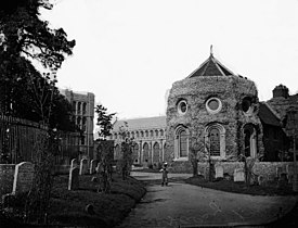 View of churchyard and (L-R) Norman Tower, St James Church and SW Tower of Abbey, c. 1920 BRO K505 0023.jpg