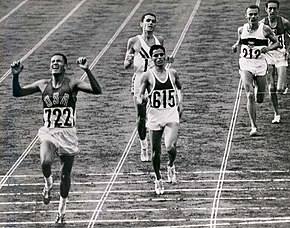 BillyMills_Crossing_Finish_Line_1964Olympics.jpg