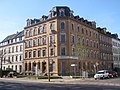 Apartment house in closed development with shop and front garden