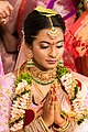 Bride offering her respects to God through a traditional gesture known as Namaskaram (01)