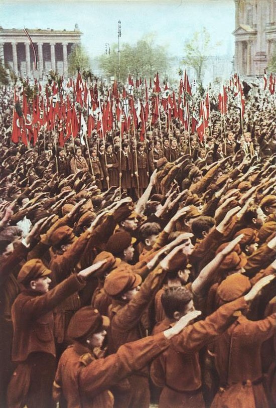 Hitler Youth giving the Hitler salute; Germans were required by law to make the salute during the singing of the "Horst Wessel Song".