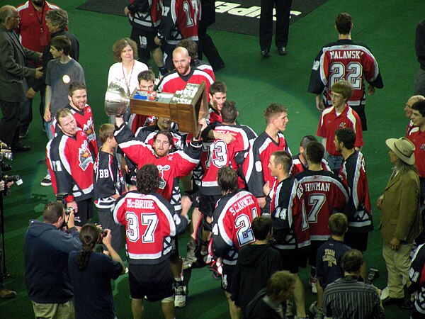 Devan Wray hoists the Champion's Cup as the Roughnecks celebrate the 2009 championship.