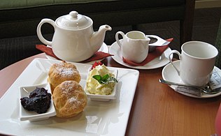 Cream tea: tea (c. 1660), scones (Scots, 16th century), clotted cream, raspberry jam (11th century)