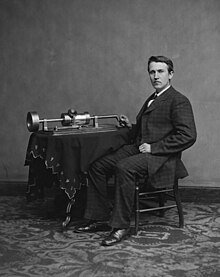 Photograph of Thomas Edison with his phonograph, taken by Mathew Brady in 1877 Edison and phonograph edit1.jpg