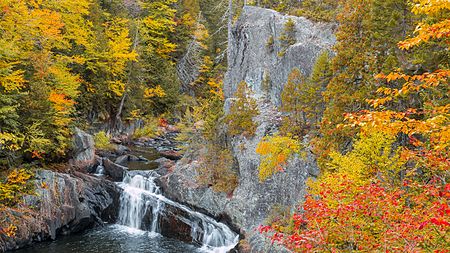 Fall foliage overlooking Buttermilk Falls in Gulf Hagas on an overcast October day in 2016. Fall Foliage Buttermilk Falls Gulf Hagas.jpg