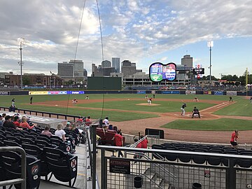A daytime baseball game being played at First Tennessee Park
