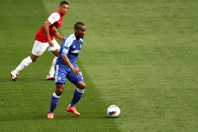 Malouda in action against Arsenal's Alex Oxlade-Chamberlain