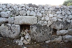 Facade with a buried entrance