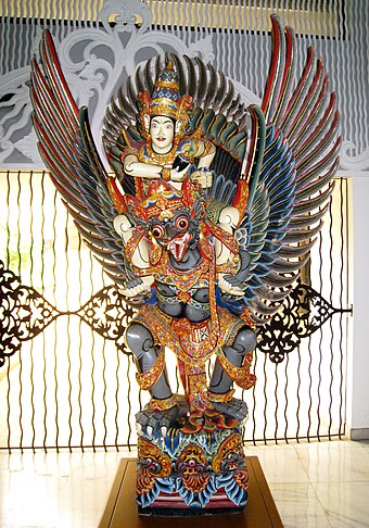 Balinese wooden statue of Vishnu riding Garuda, Purna Bhakti Pertiwi Museum, Jakarta, Indonesia.