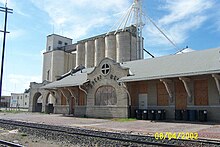 Downtown grain elevator and abandoned Santa Fe railroad station Great Bend Train Station Grain Elevator.jpg