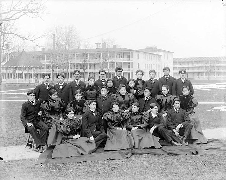 File:Group of Male and Female Students; Brick Dormitories And Bandstand in Background 1879.jpg