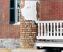 Plastered brick columns before the 2002 renovation, showing the construction method of the column. Jameswithrow column.jpg