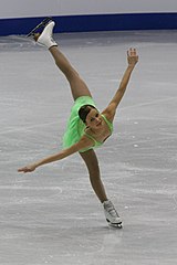 A basic outside edge spiral position with the free leg held unsupported behind the body