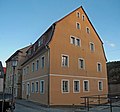 Residential house with basket arch door