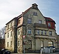 Apartment house in a corner and open development