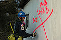 2005 - English: Biloxi, Miss - A member of the Indiana Task Force 1 Urban Search and Rescue (US&R) team marks a damaged house after searching for victims of Hurricane Katrina.