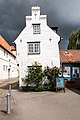 * Nomination House “An der Mauer 51”, Lübeck, Schleswig-Holstein, Germany The building itself is strong tilted, in the background rain clouds, the house itself is in sunshine. --XRay 05:25, 20 July 2017 (UTC) * Promotion  Support Yes, the verticals are vertical, the house is not ;-) --Llez 11:14, 20 July 2017 (UTC)