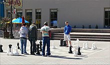 Playing chess on the Strand Lets Play Chess Strand Galveston.jpg