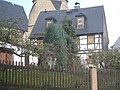 Residential house with garden and surrounding wall