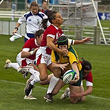 Evans in a tackle against Australia's Nicole Beck in one of her last appearances in the 2010 World Cup Nicole Beck takes an impact from Non Evans Ouch!!.jpg