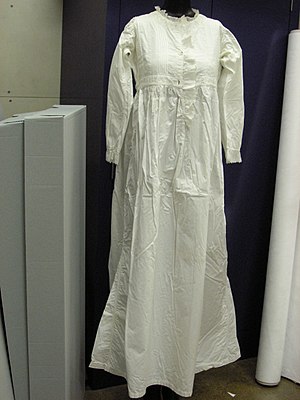 19th-century simple white cotton nightgown with embroidery insertion and lace trimming
