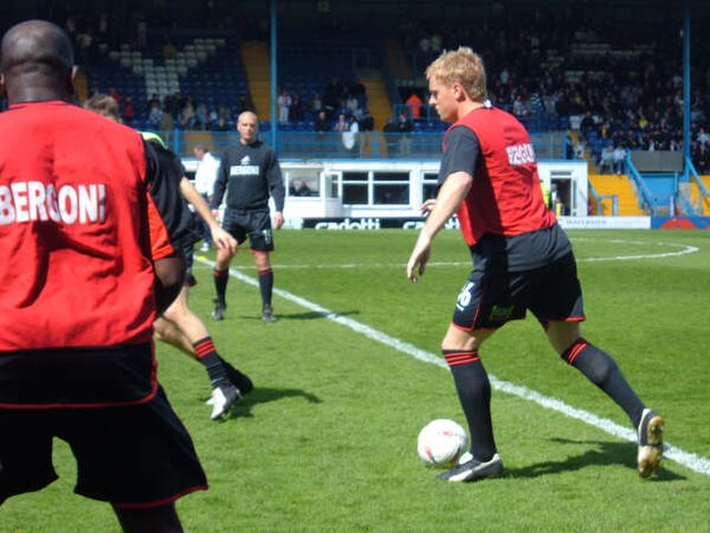 Monk warming up for Swansea before a League Two match at Bury during the 2004–05 season