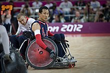 Retired U.S. Sailor William Groulx, the U.S. wheelchair rugby team captain, rolls into position to defend against the Great Britain team during a match at the Paralympic Games in London Sept 120905-F-FD742-702.jpg