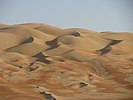 Rust-tinged desert around Liwa Oasis, United Arab Emirates