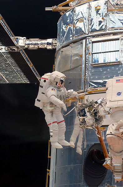 John Grunsfeld works on the Hubble Space Telescope during STS-125 May 14, 2009