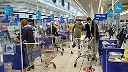 Self-service checkout machines reducing required staff. Self-service checkouts in Tesco in Poland.jpg