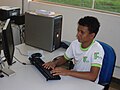 Student at the Campus Ituiutaba do Instituto Federal do Triângulo Mineiro, typing on a keyboard.jpg