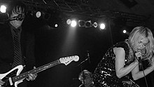 Sweethead performing at Strasse E in Dresden, 2009. Pictured: Troy Van Leeuwen (left) and Serrina Sims (right).